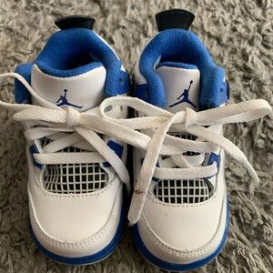 Baby Jordans. Lightly used. Blue and white. Small stain on shoe lace.